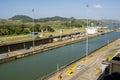 Cargo ship lowered in first lock at Panama Canal Royalty Free Stock Photo