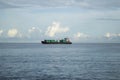 a cargo ship offshore waiting in line to unload at the port Royalty Free Stock Photo