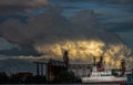 A cargo ship parked in front of Petroleum refinery on the Chao Phraya River in the evening Royalty Free Stock Photo