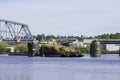 Cargo ship passing through a swing bridge