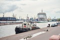 cargo ship in a port against working crane bridge