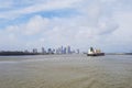 Cargo ship on a river and New Orleans city in background