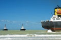 Cargo ship run aground on rocky shore Royalty Free Stock Photo