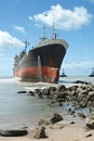 Cargo ship run aground on rocky shore Royalty Free Stock Photo