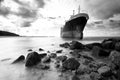 Cargo ship run aground on rocky shore shore Royalty Free Stock Photo