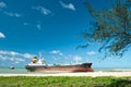Cargo ship run aground on rocky shore Royalty Free Stock Photo