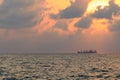 A cargo ship sailed on the horizon of the Sea Royalty Free Stock Photo