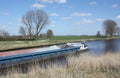 Cargo ship sails on the Reitdiep.Netherlands Royalty Free Stock Photo