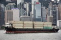 Cargo Ship in sea of Victoria Harbour between Kowloon and Hong Kong island sailing go to ocean