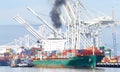 Cargo ship SEASPAN HAMBURG entering the Port of Oakland, Diesel exhaust air pollution Royalty Free Stock Photo