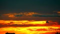 Cargo ship slow moving on sea and sunset red orange colud on sky