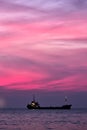 Cargo ship in South China Sea at dusk, Vietnam