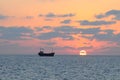 Cargo ship and sunset.