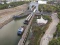 Cargo ship, Cargo transportation of technological equipment for a refinery by water. The river freight train passes lock in the Royalty Free Stock Photo