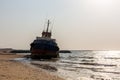 Cargo ship wreck washed ashore on the Al Hamriyah beach in Umm Al Quwain, United Arab Emirates