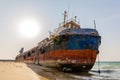 Cargo ship wreck washed ashore on the Al Hamriyah beach in Umm Al Quwain, United Arab Emirates