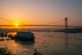 A cargo ship on the Yangtze River under the shining glow of the sunrise passes Cuntan Port