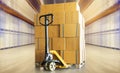 Cargo shipment boxes. Commercial warehousing. Hand pallet truck with Stack of package boxes at storage warehouse. Royalty Free Stock Photo