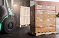 Cargo shipment boxes. Industry freight truck and warehousing. Forklift loading cargo into shipping container. Logistics transport. Royalty Free Stock Photo