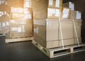 Cargo shipment boxes. Stacked of package boxes on pallet rack at the warehouse storage. Manufacturing and warehousing. Royalty Free Stock Photo