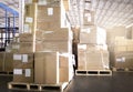 Cargo shipment boxes. Stacked of package boxes on pallet rack at the warehouse storage. Manufacturing and warehousing. Royalty Free Stock Photo