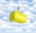 Cargo shipping container in yellow with an inscription delivery loading concept the crane lifts the container on cloud background Royalty Free Stock Photo