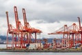 Cargo shipping dock with cranes and shipping containers Royalty Free Stock Photo