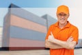 Cargo shipping logistic worker with container background space for advertising.Portrait caucasian warehouse staff standing smile