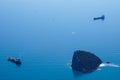 The cargo ships are at anchor near Antalya (Turkey) bay with the rocky island - aerial drone view Royalty Free Stock Photo