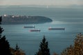 Cargo ships anchored in Burrard Inlet near Point Grey in Vancouver, BC. Royalty Free Stock Photo