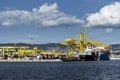 Cargo ships docked at Pier VII of the Port of Trieste loading:unloading containers Royalty Free Stock Photo