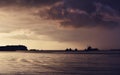 Cargo ships in horizon on sunset in Marsaxlokk, Malta