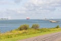 Cargo ships and industrial harbour. Botlek, Rozenburg, Netherlands. June 6, 2025 Royalty Free Stock Photo