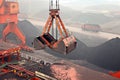 Cargo terminal for discharging coal cargos by shore cranes during foggy weather. Port Bayuquan,China. Royalty Free Stock Photo