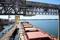 Cargo terminal for loading bulk cargoes woodpellets and containers by coastal cranes. Port Prince Ruppert BC, Canada.