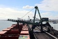 Cargo terminal for loading coal cargos by shore cranes. Port Gladstone, Australia. December, 2019.