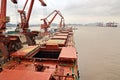 Cargo terminal for unloading grain cargo to coastal cranes. Port Zhoushan, China. November, 2019. Royalty Free Stock Photo