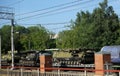 Cargo train carrying military equipment and military armed tanks on a freight platform Royalty Free Stock Photo