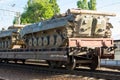 Cargo train carrying military tanks on railway flat wagons Royalty Free Stock Photo