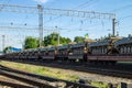 Cargo train carrying military tanks on railway flat wagons Royalty Free Stock Photo