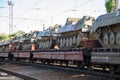 Cargo train carrying military tanks on railway flat wagons Royalty Free Stock Photo