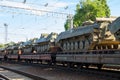 Cargo train carrying military tanks on railway flat wagons Royalty Free Stock Photo