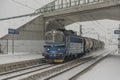 Cargo train near railway stop with snowy bridge 12 16 2022 Veseli nad Luznici CZ