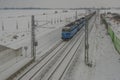 Cargo train near railway stop with snowy bridge 12 16 2022 Veseli nad Luznici CZ