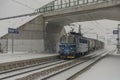 Cargo train near Veseli nad Luznici stop with snowy platforms and cloudy sky