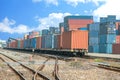 Cargo train platform with freight train container at depot Royalty Free Stock Photo