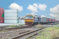 Cargo train platform with freight train container at depot Royalty Free Stock Photo