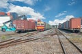 Cargo train platform with freight train container at depot Royalty Free Stock Photo