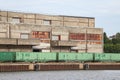 Cargo train standing near old brick building in docks