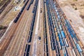 Cargo trains. Aerial view of colorful freight trains on the railway station. Wagons with goods on railroad.Aerial view Royalty Free Stock Photo
